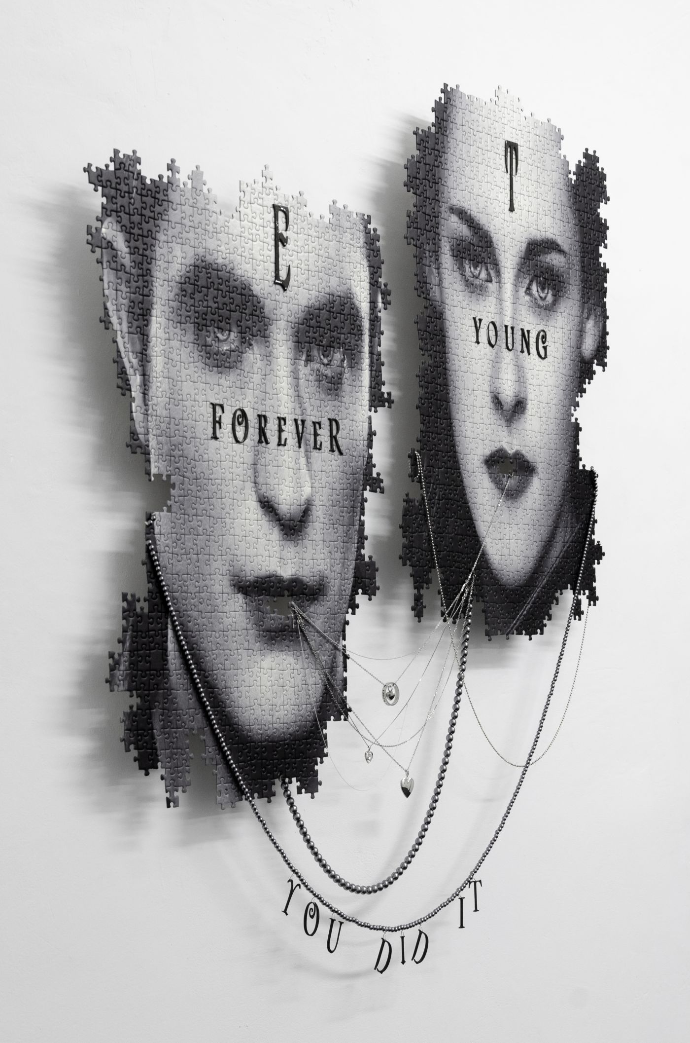 Julian-Jakob Kneer, EROS / THANATOS (YOU DID IT, FOREVER YOUNG), 2021, Digital print on puzzle, silver and steel chains, engraved silver and steel lockets, plastic coated jewelry, aluminium construction, 105cm x 90cm x 7cm